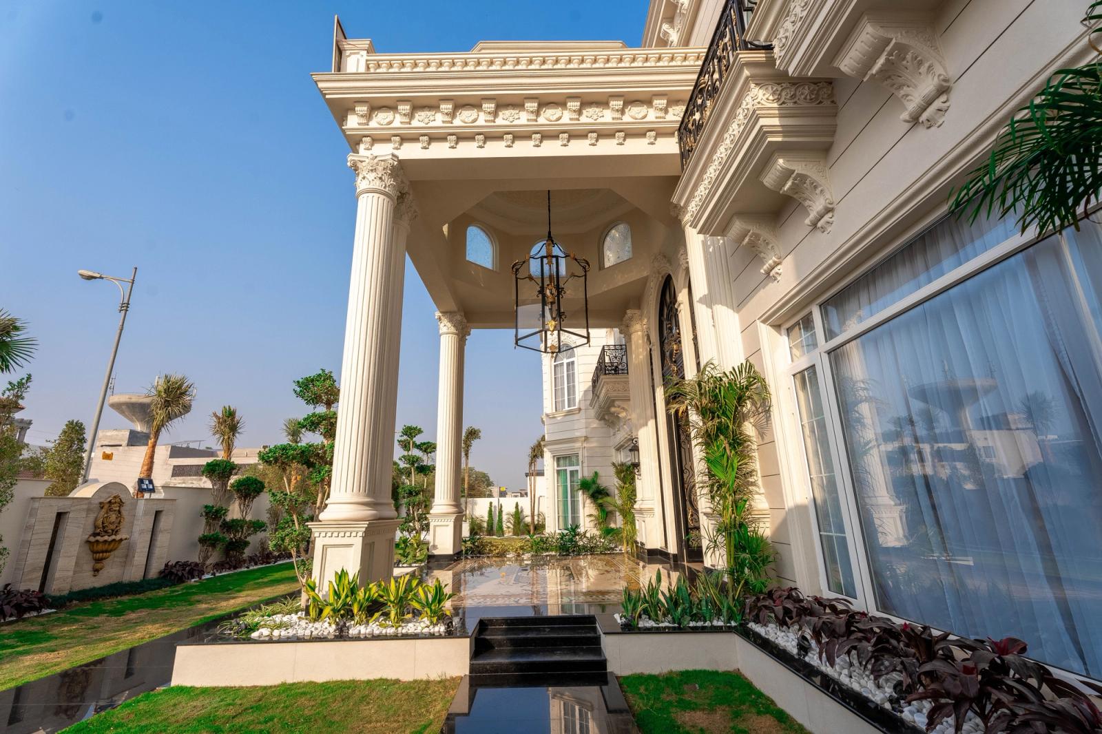 A palatial classical estate with grand, ornate interiors.
