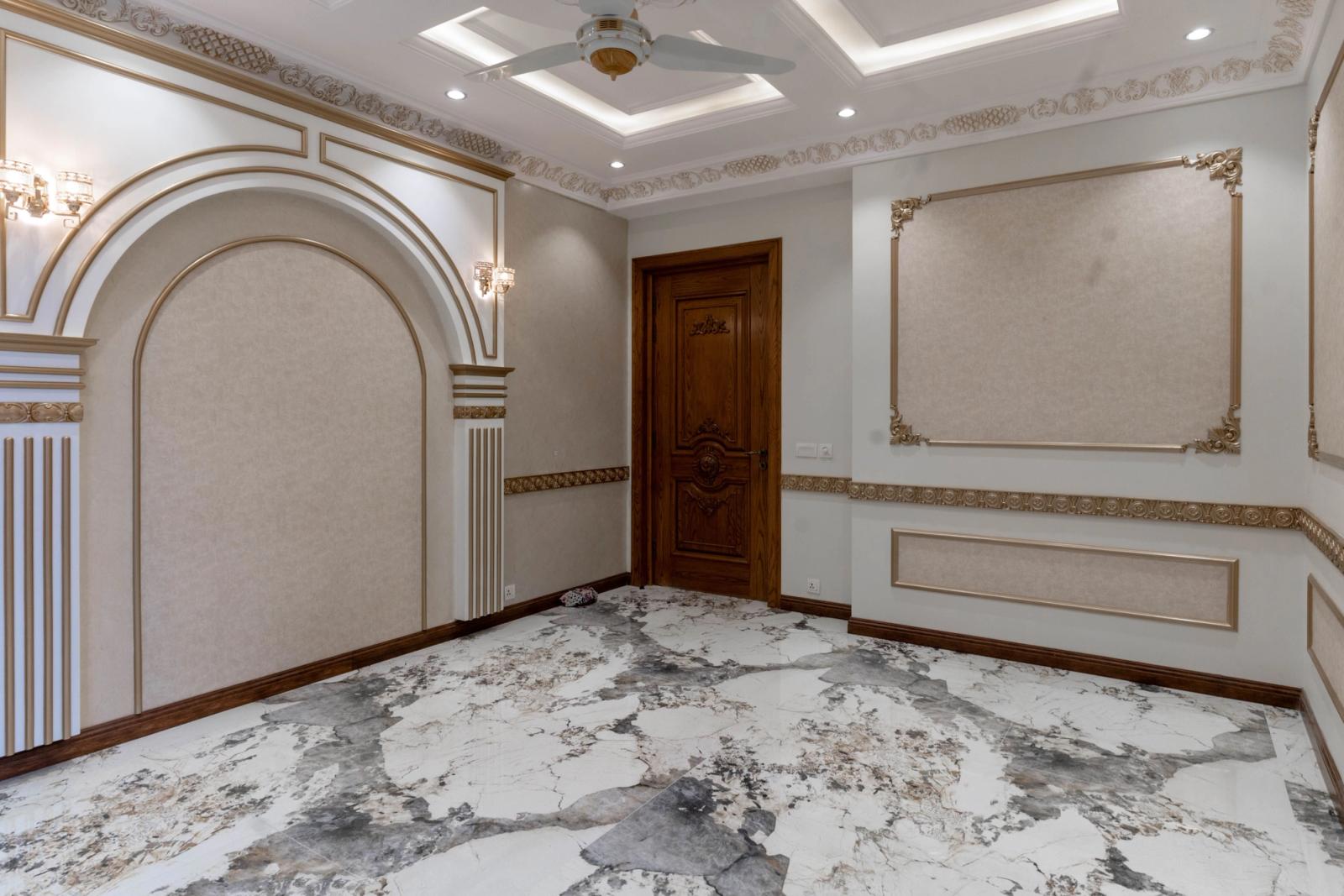 A Mediterranean-revival villa with arched loggias and a tiled roof.
