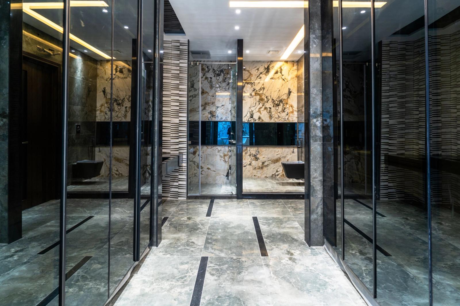 A boxy grey contemporary steel-and-glass villa.