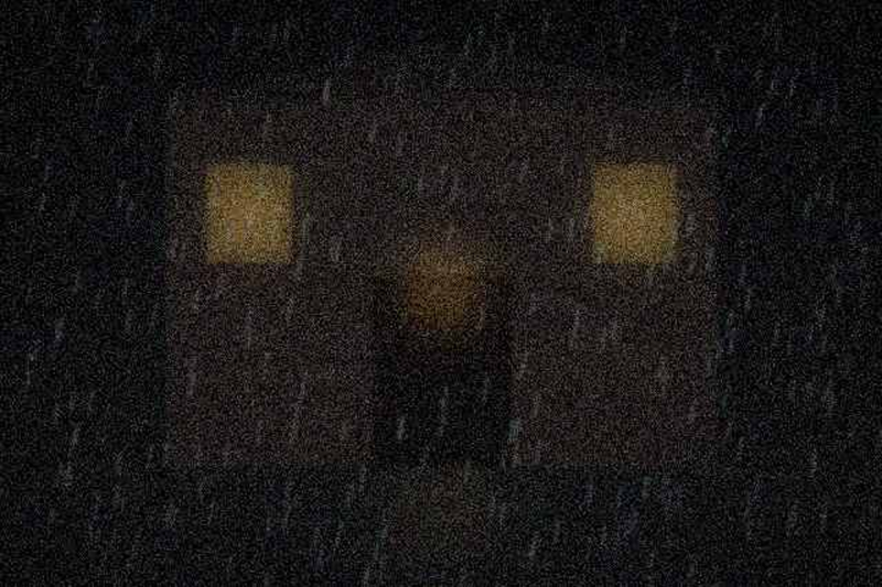 The hall entrance, side street, in the rain