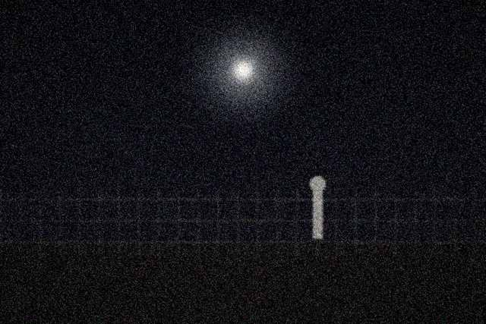 Stationary light above the fence line