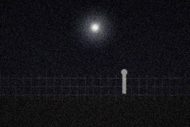 Stationary light above the fence line