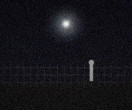 Stationary light above the fence line