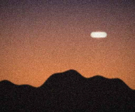 White object over the ridge line