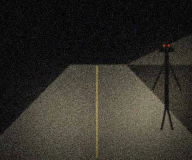 Thin figure at the edge of the headlight beam