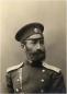 Studio portrait of a bearded man wearing a military-style uniform and cap, identified as amateur photographer Sergei Margulov, 1897.