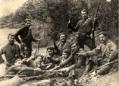 Group portrait of armed men outdoors, titled “The Forest Brotherhood,” photographed by Vasil Roinashvili.