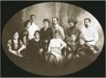 Group portrait of members of the Didebulidze family arranged in two rows.
