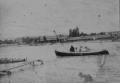 Sepia-toned photograph showing a small wooden boat with several passengers on a river, with low buildings visible along the opposite bank.