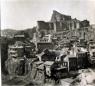 View of Old Tiflis with wooden balcony houses built along the cliffs beneath Narikala fortress.