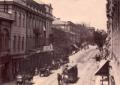 Horse-drawn tram moving along Golovin Prospect in Tiflis with carriages, pedestrians, and historic buildings.