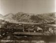 Historic black-and-white panoramic photograph of Akhaltsikhe with Rabati fortress on a hill above the town.