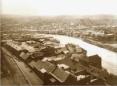 Panoramic view of the Rike district along the Mtkvari River with dense historic houses in Tbilisi.