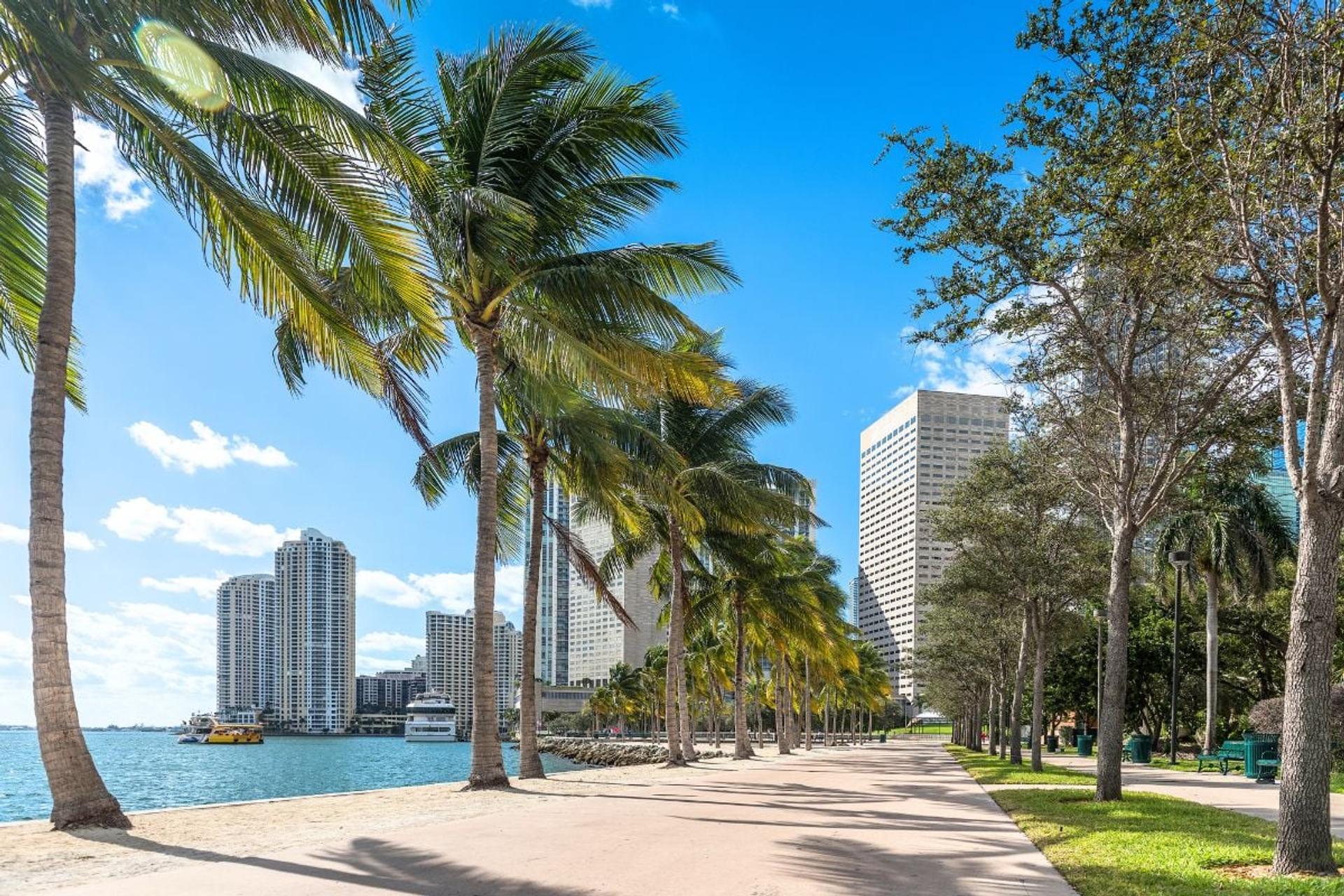 Brickell Key Park waterfront walking path with Miami skyline views