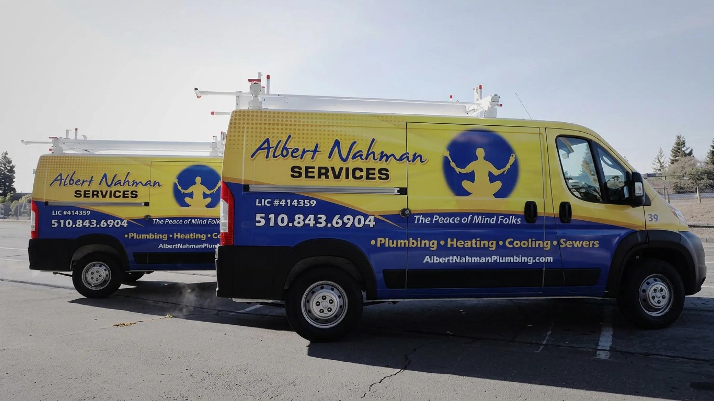 Two Albert Nahman Services vans