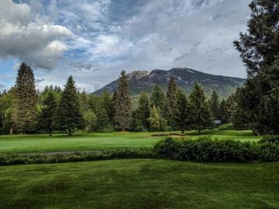 Golf green in Whistler with mountain in the background