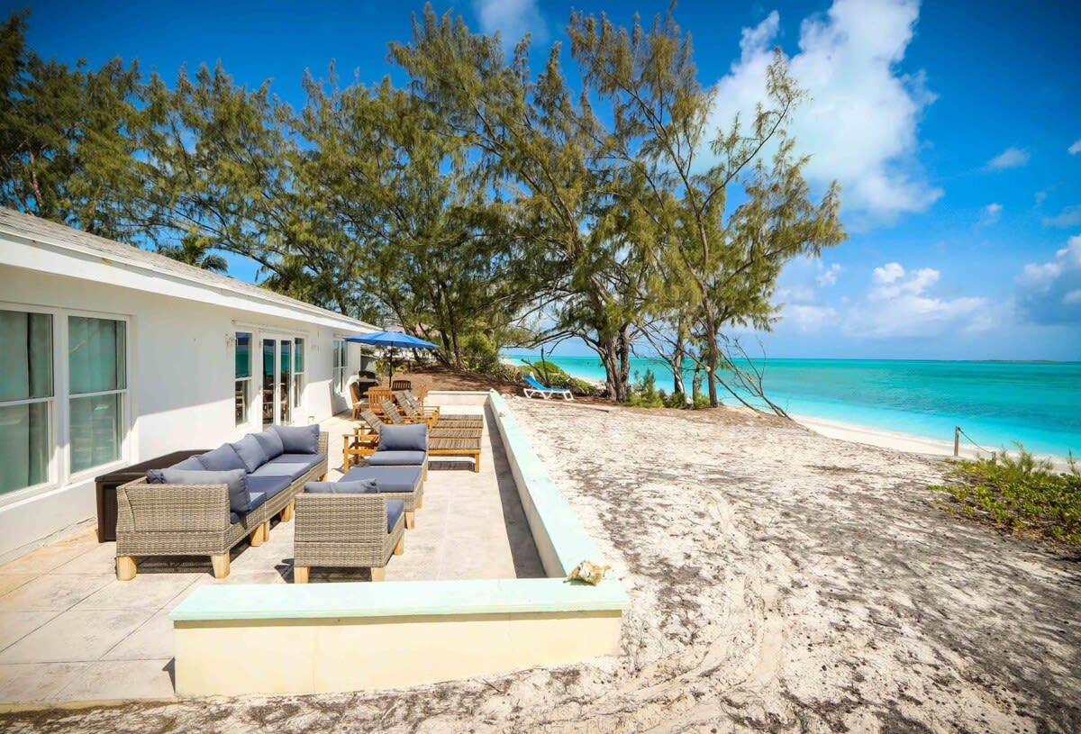 Beachfront white palm villa