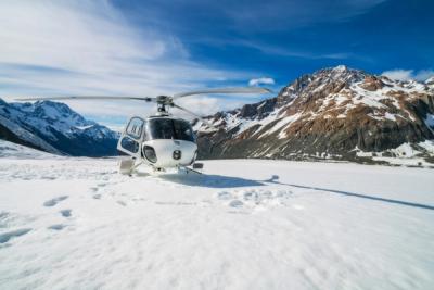Helicopter parked in snow in the mountains