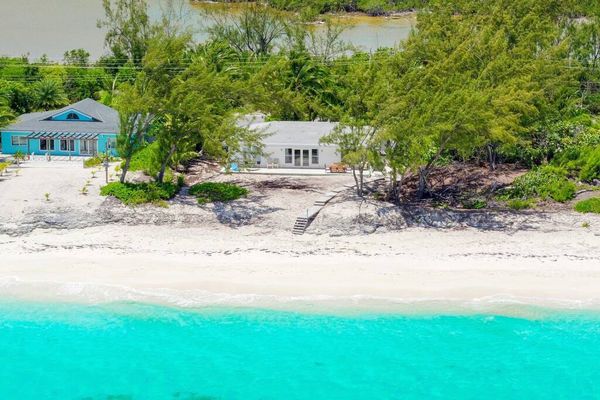 Beachfront white palm villa