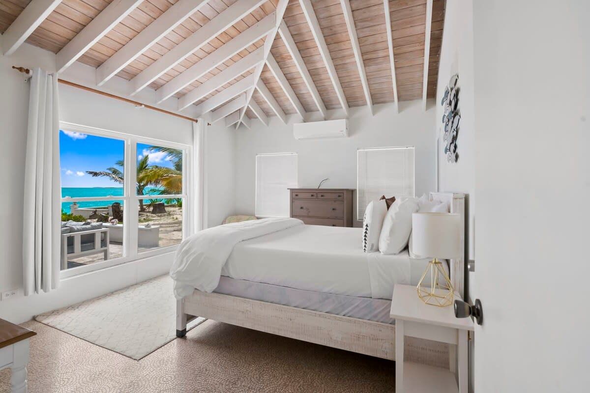 Beachfront white palm villa