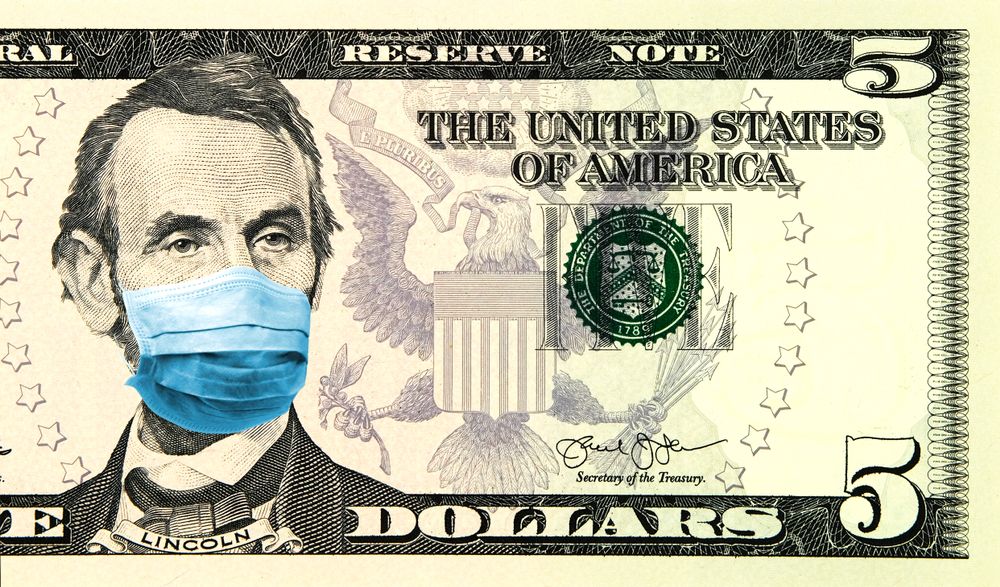 Five dollar bill with covid mask
