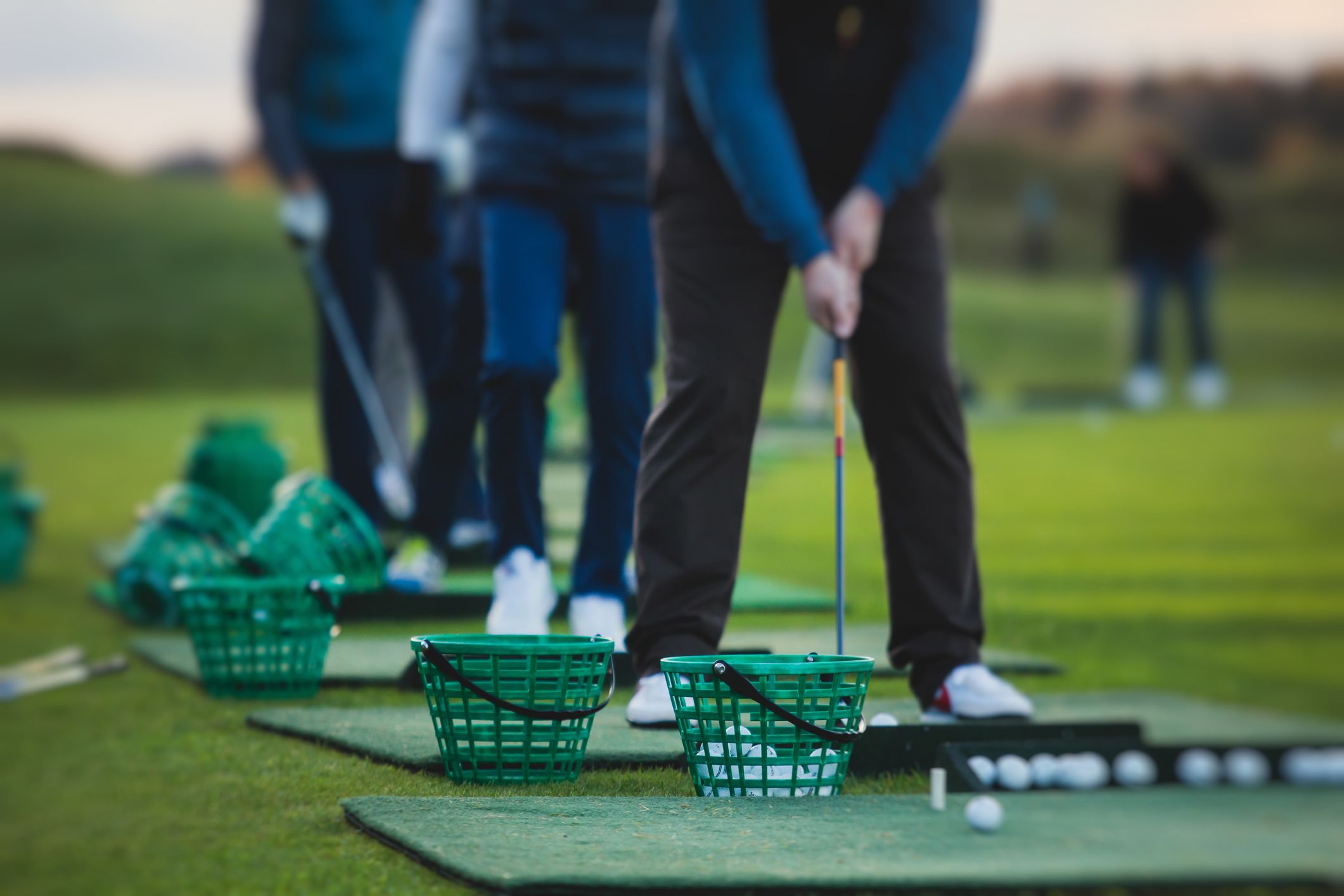 Man hitting golf ball.