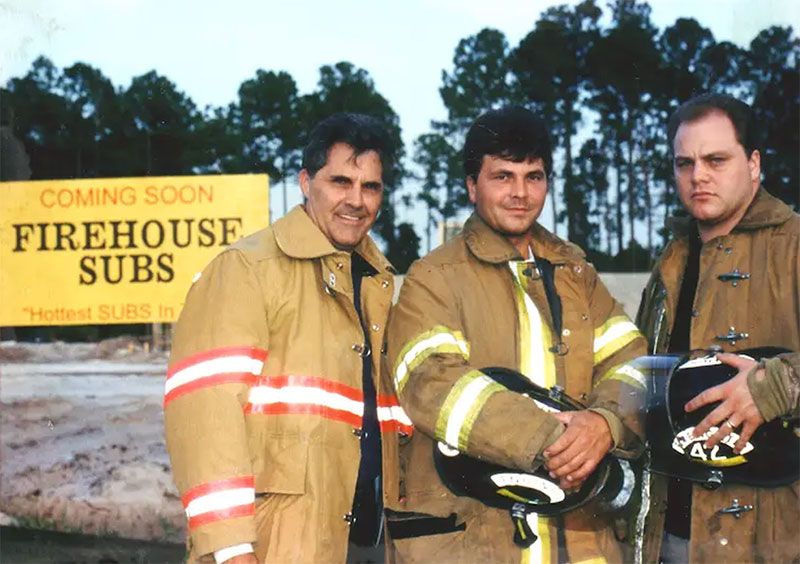 Founders Chris and Robin Sorensen, pictured with their father Rob, before opening the first Firehouse Subs restaurant in Jacksonville, Florida
