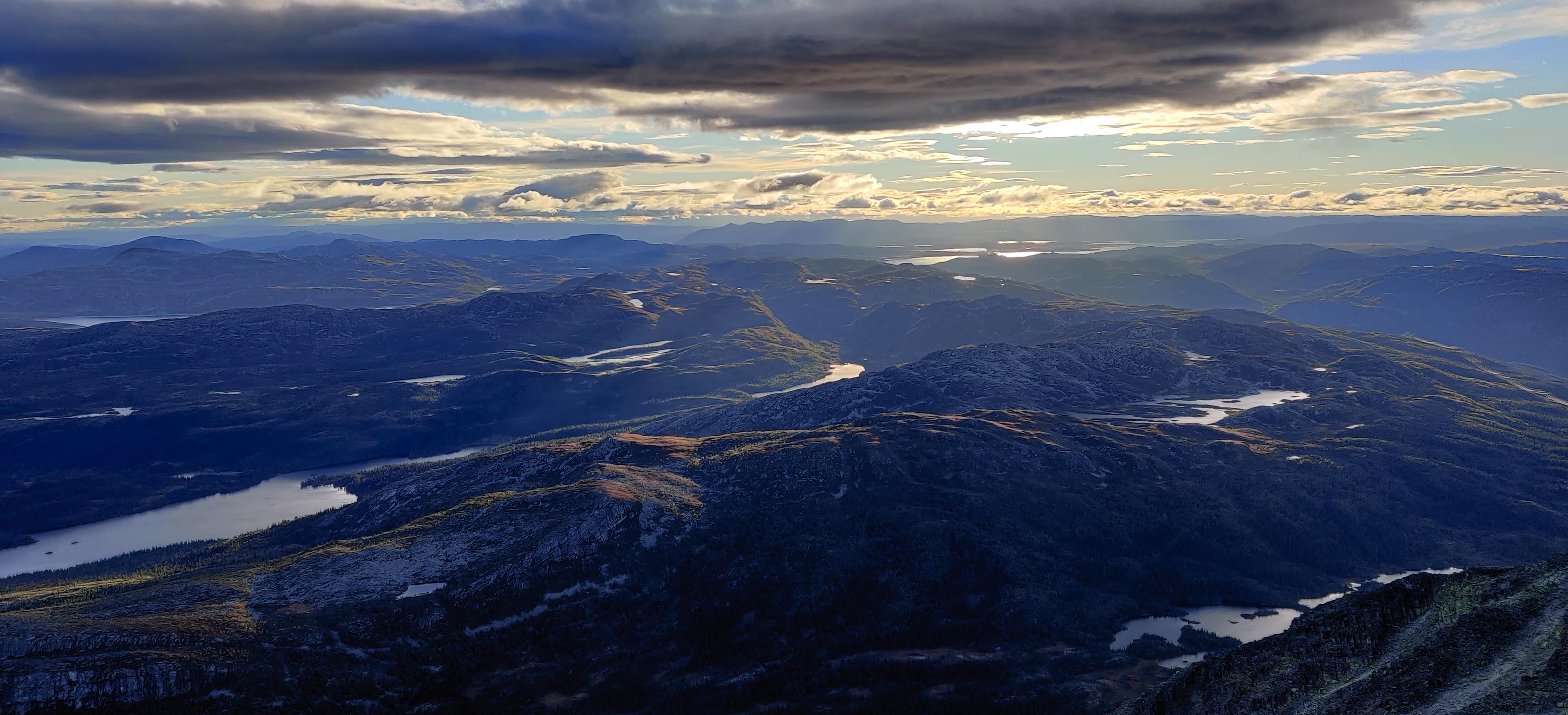 a group of people are posing for a picture on a bridge