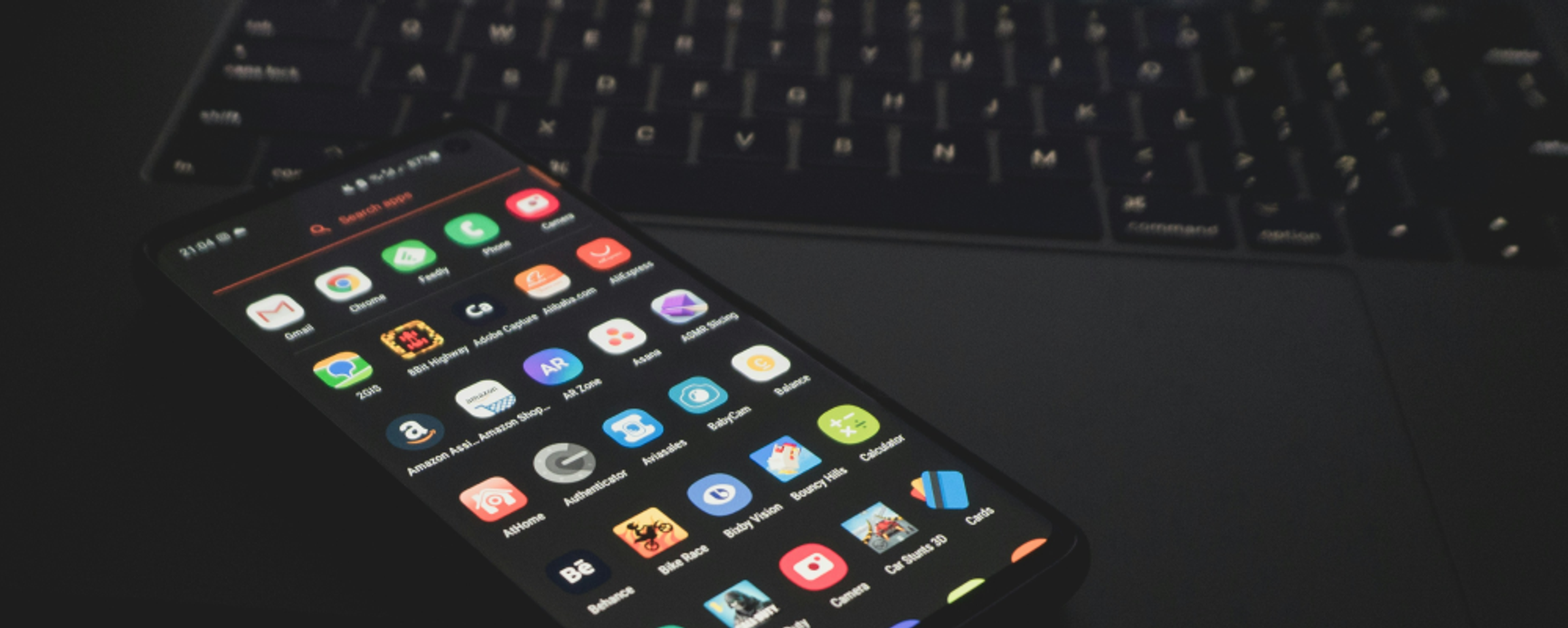 smartphone on laptop keyboard