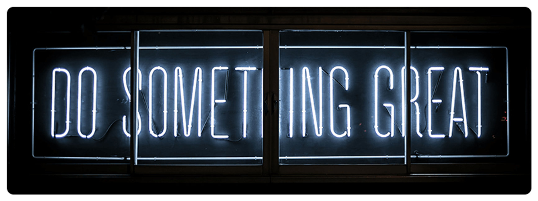 A photo of a neon sign that says "DO SOMETHING GREAT"