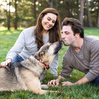 Couple enjoying time with their dog