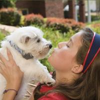 girl holding puppy