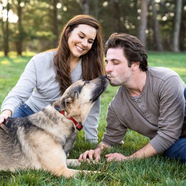 Couple enjoying time with their dog