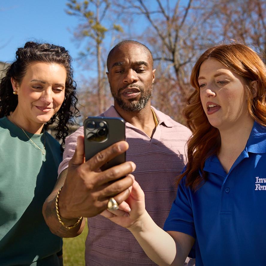 Pet trainer guiding man and woman through mobile app setup