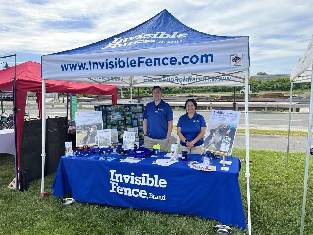 invisible fence team members working at a local event in northeast new york