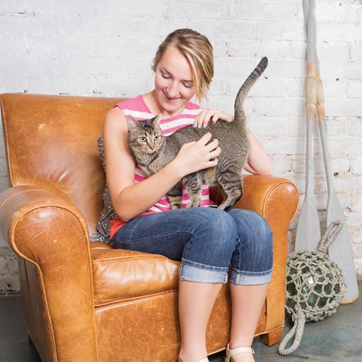 woman holds new kitten