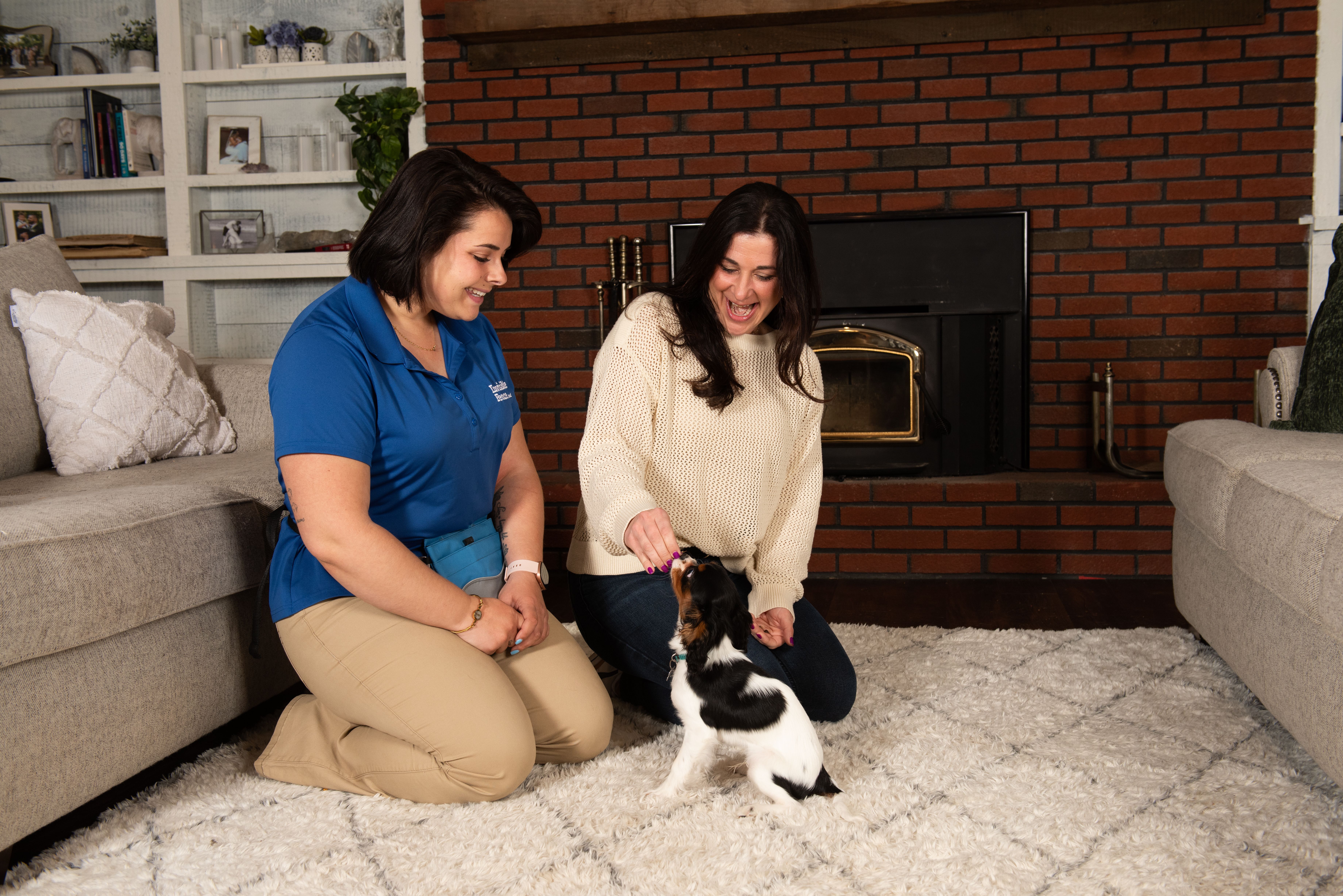 Invisible Fence® trainer with dog and owner during a training session
