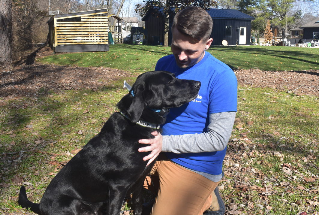 invisible fence of middle tennessee trainer working with a dog