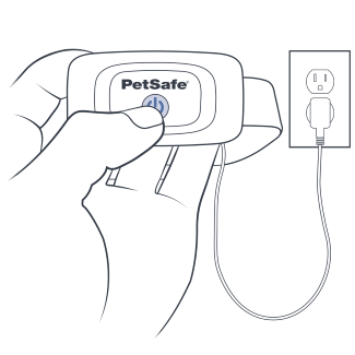 Press & hold power button while attached to charger