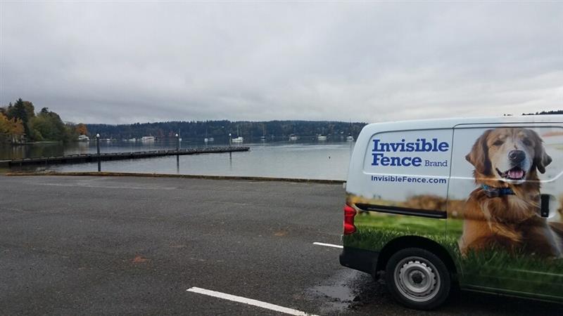 invisible fence brand van in parking lot in front of ocean bay