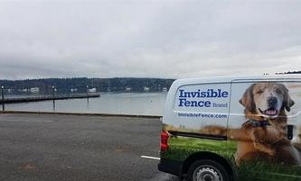 invisible fence brand van in parking lot in front of ocean bay