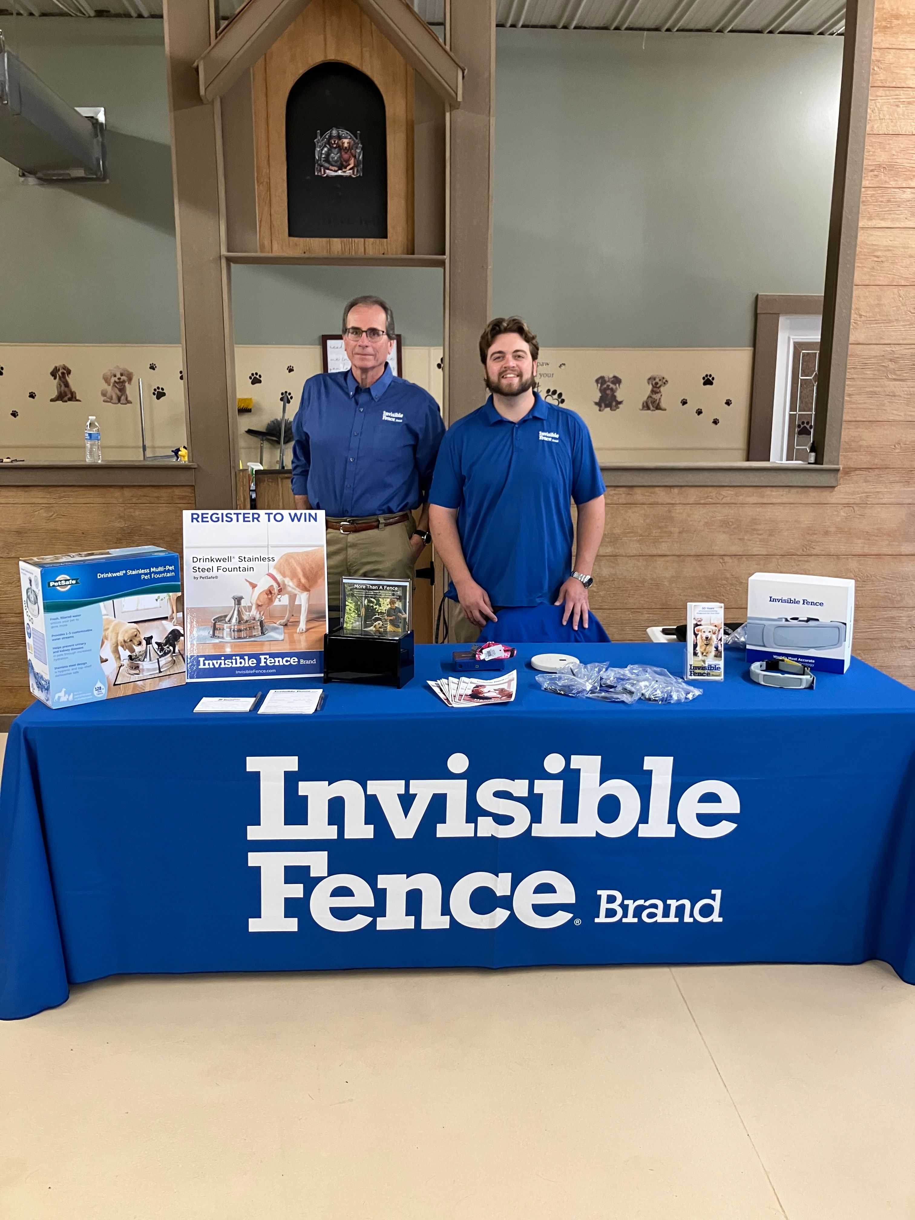 Invisible Fence trainers at event for