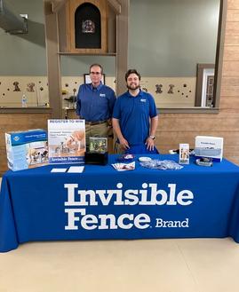 Invisible Fence trainers at event for