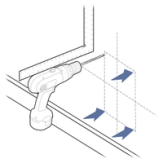 Drill holes inside edges of template on wall