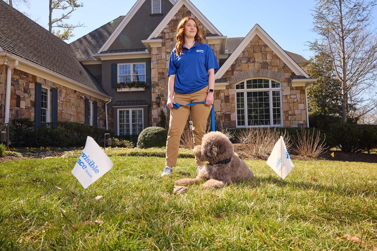Trainer works with poodle in yard with Invisible Fence GPS Wireless Dog Fence 