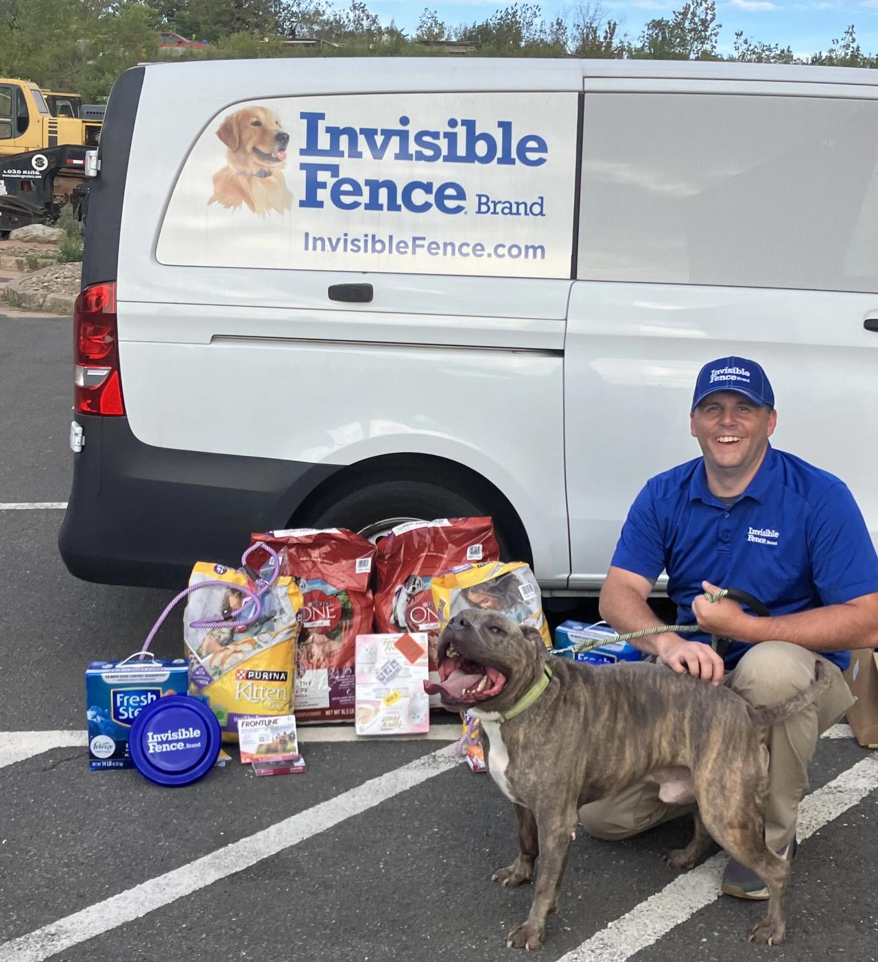 Invisible Fence of Connecticut trainer with donation of supplies for a local shelter
