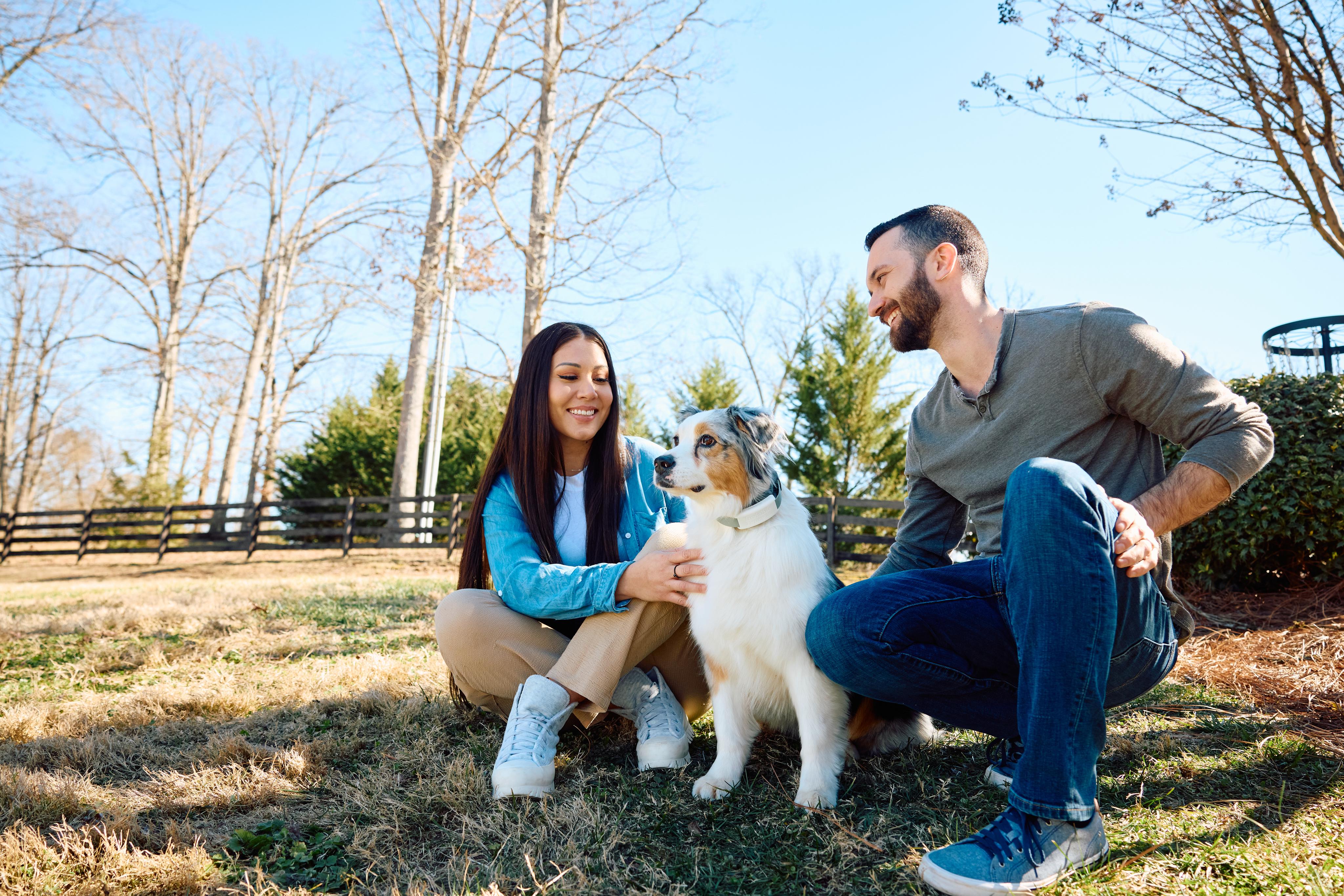 Man and woman with dog. Text on image reads Get Started with GPS Flex Fence, Freedom at your Fingertips