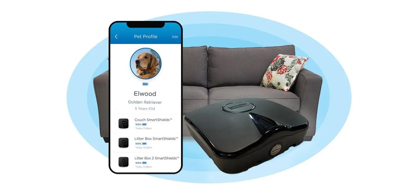 Smart shield in door dog fence pictured next to a couch with the Invisible Fence app 