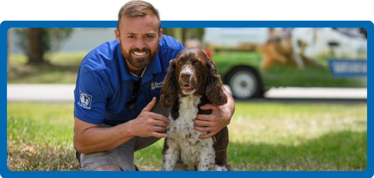 Invisible Fence® trainer posing with a dog