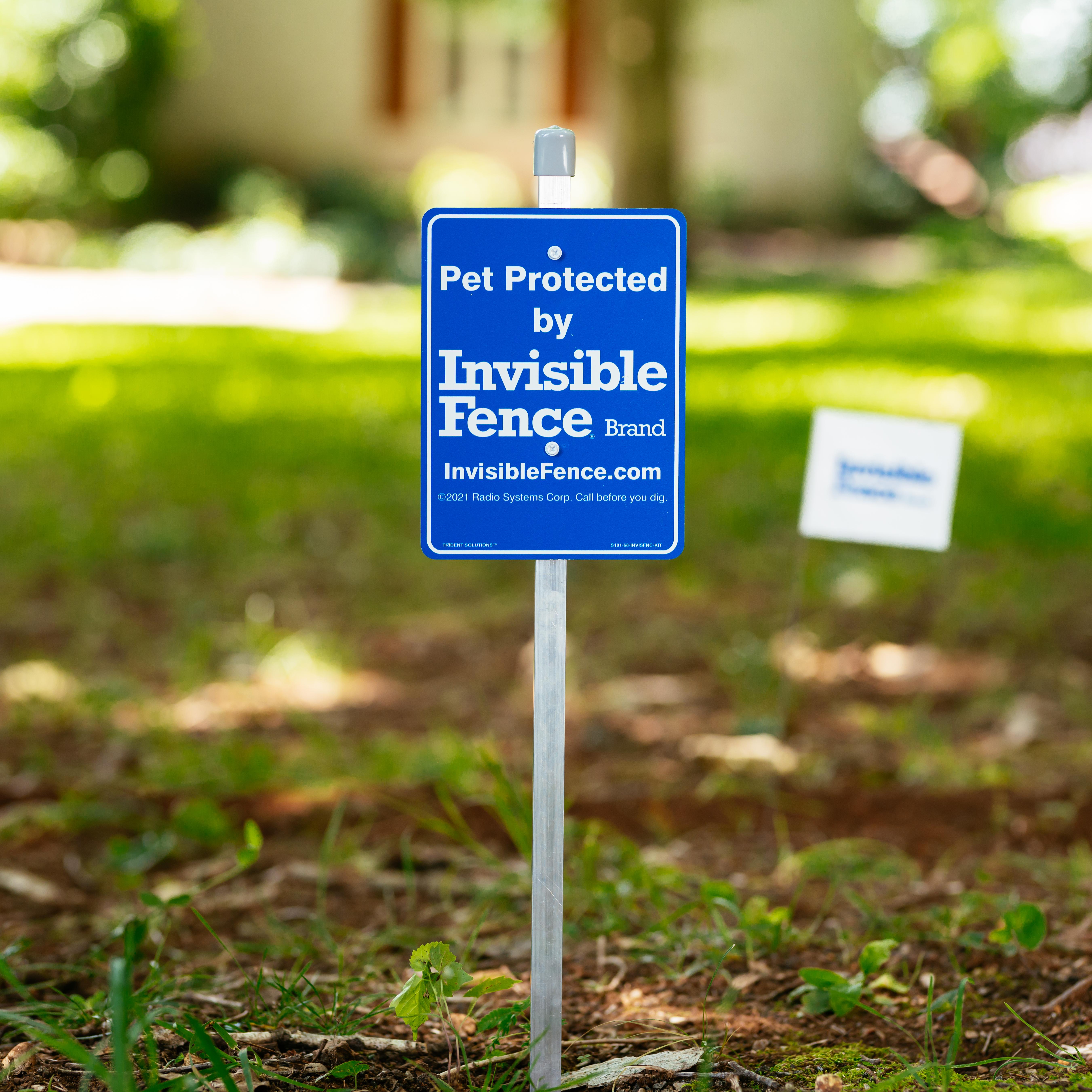 Pet Protected by Invisible Fence Brand sign in front yard.